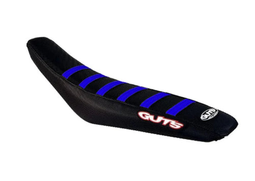 A black motorcycle or scooter seat cover with blue diagonal stripes and red 'GUTS' branding, shown on a plain white background.